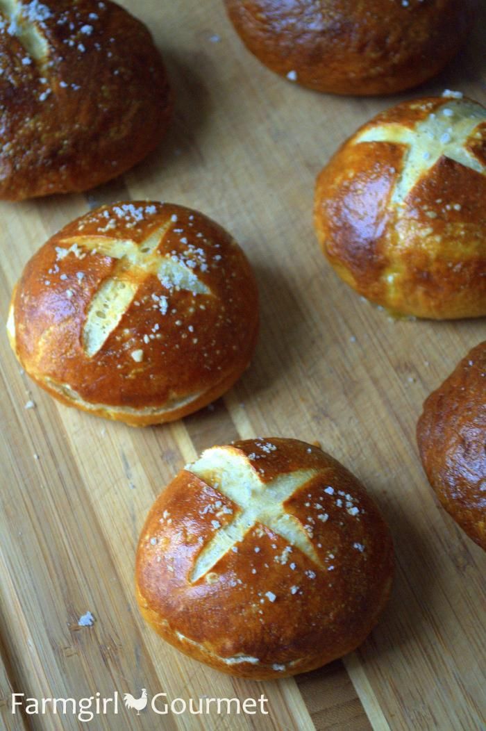 freshly baked hot cross buns on a cutting board