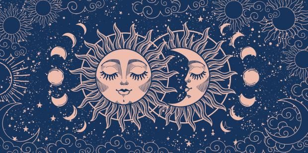 two sun and moon faces with stars in the sky