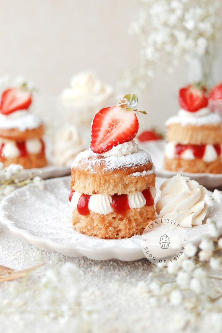 strawberry shortcakes with whipped cream and fresh strawberries on top, ready to be eaten