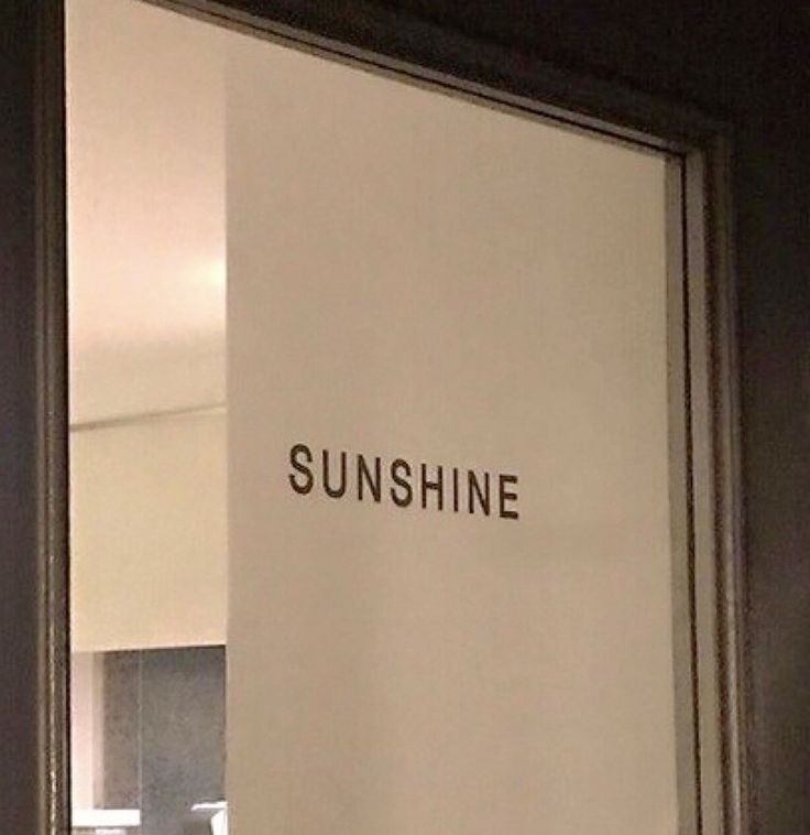 an open door with the words sunshine written on it in black and white letters,