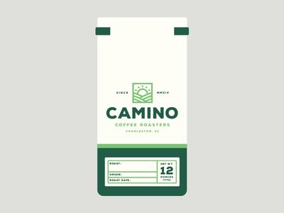 a carton of coffee beans with the label for camino's coffee roasters