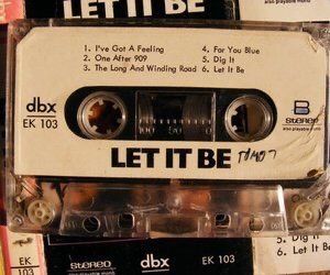 an old cassette tape recorder with the words let it be printed on it's side