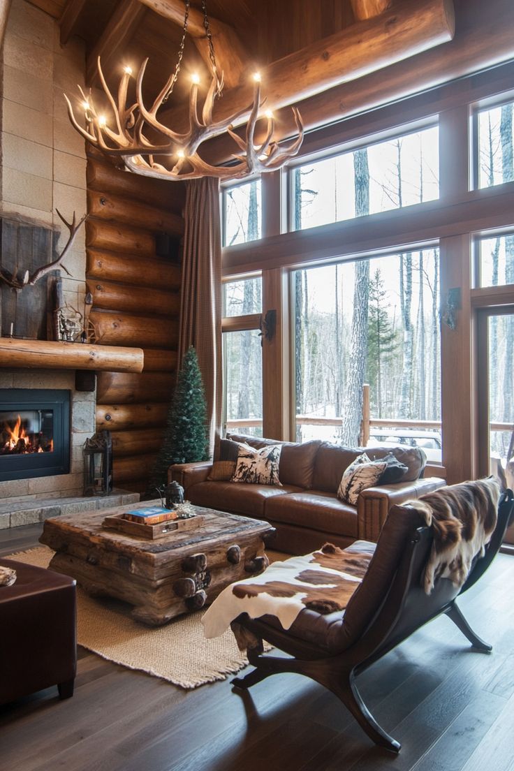 a living room filled with furniture and a fire place in front of a large window