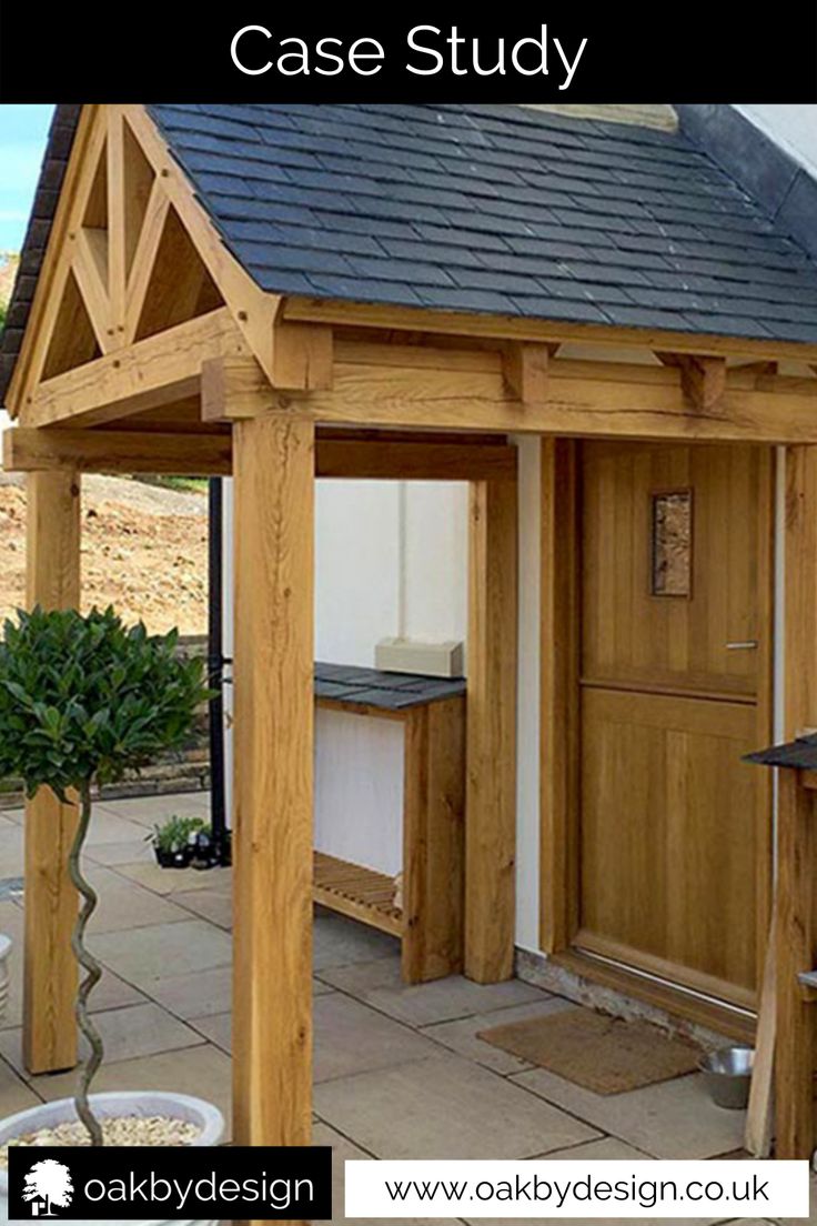 a wooden gazebo sitting on top of a patio next to a potted plant