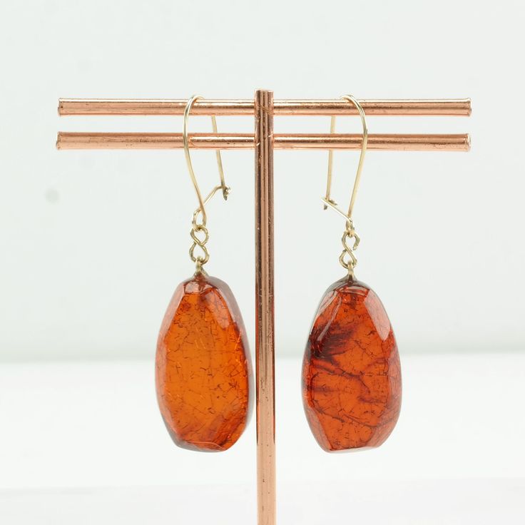 "These vintage amber earrings are 15/16\" long, and 1/2\" wide The earrings weigh 3.9 Grams The Stone/Theme is Amber - Natural, heated amber Size/Stone measurement (if any) are 24.1 x 13.4 mm  Markings: Not marked The condition of the earrings is Estate, Very good, a few surface scratches, light patina, Amber stone is crazed Extra Note: Hooks are not Sterling Silver, they are gold in color, either gold-filled or karat gold, but we haven't tested them Circa 1960 Thank you for viewing my item!" Vintage Amber Dangle Earrings, Vintage Amber Drop Earrings, Rust Dangle Earrings With Ear Wire, Amber Dangle Earrings With Lever Back, Amber Dangle Earrings With Lever Back Ear Wires, Rust Color Dangle Earrings With Ear Wire, Brown Long Drop Earrings For Gift, Amber Drop Earrings With Ear Wire, Elegant Tortoiseshell Drop Earrings