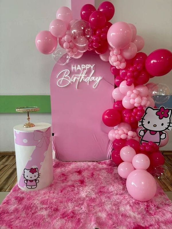 a hello kitty themed birthday party with balloons