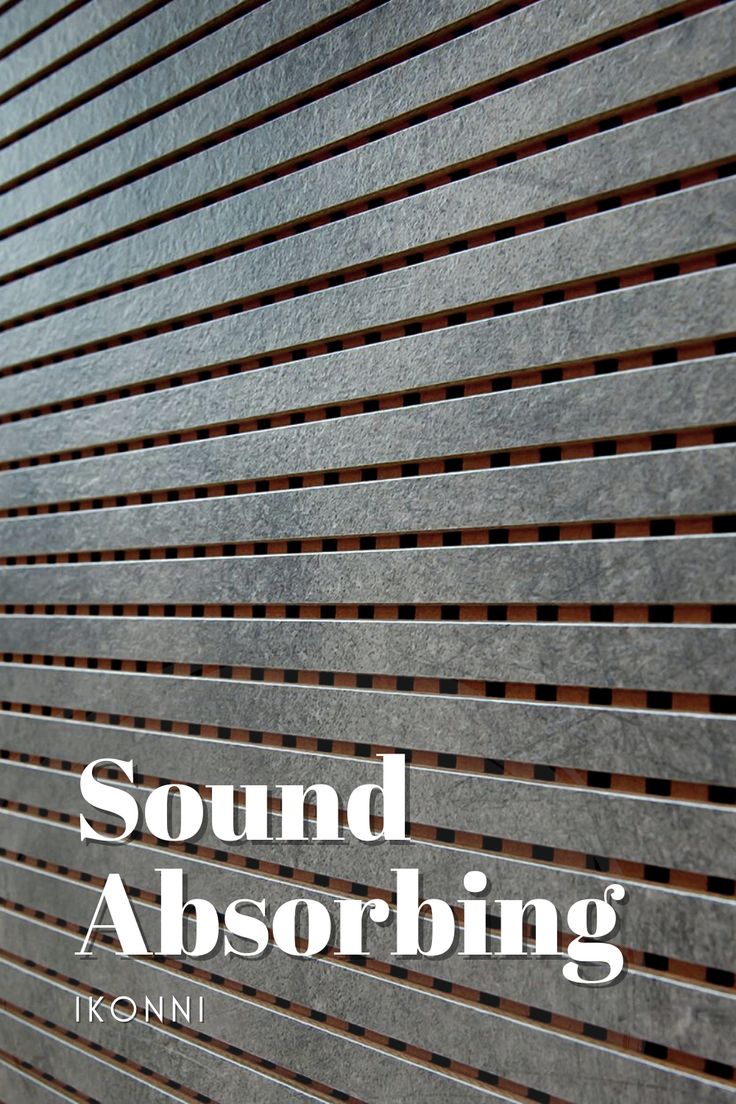 the words sound absorbing are written on a metal wall with wood slats in front