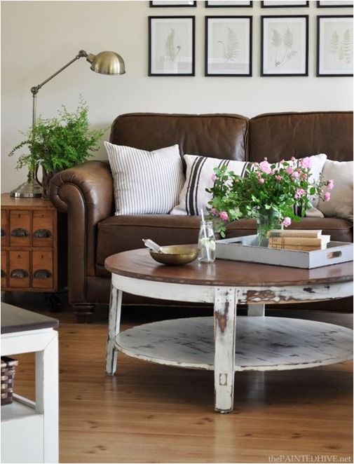 a living room with two couches and a coffee table in front of the couch