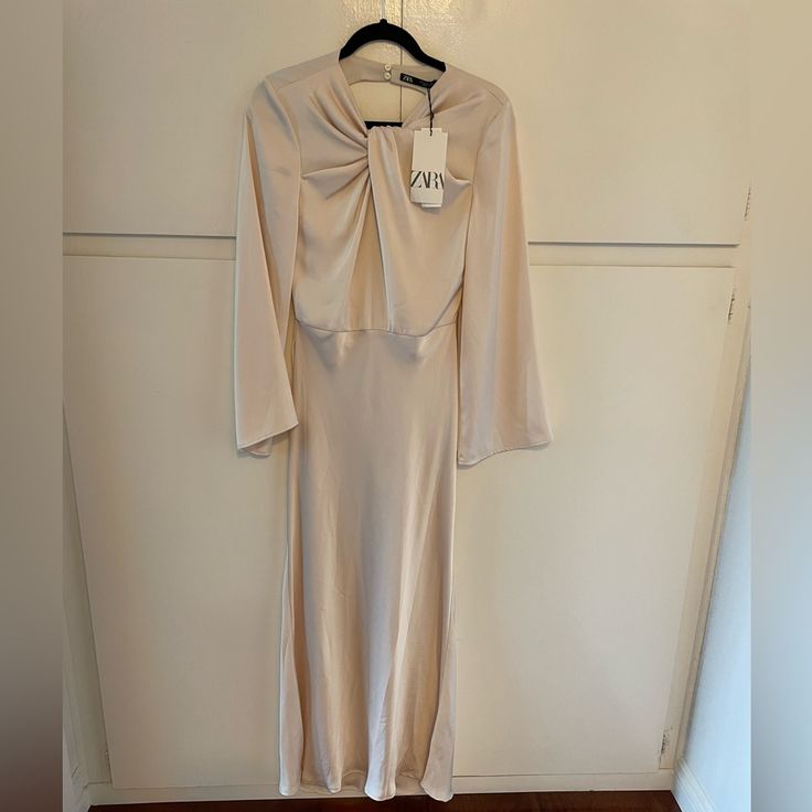 Zara Dress Chic Beige Evening Dress, Chic Beige Long Dress, Spring Satin Maxi Dress, Chic Long Beige Dress, Elegant Zara A-line Dress, Cream A-line Maxi Dress For Evening, Spring A-line Maxi Dress For Dinner, Chic Beige Evening Dress For Spring, Spring Evening Long Sleeve Sheath Dress