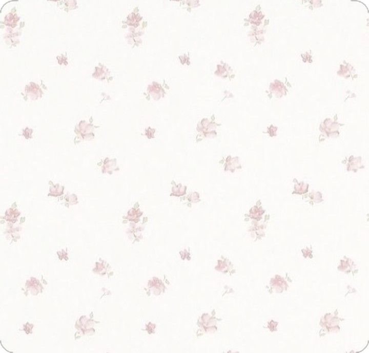 a white and pink wallpaper with small flowers on the bottom half of it,