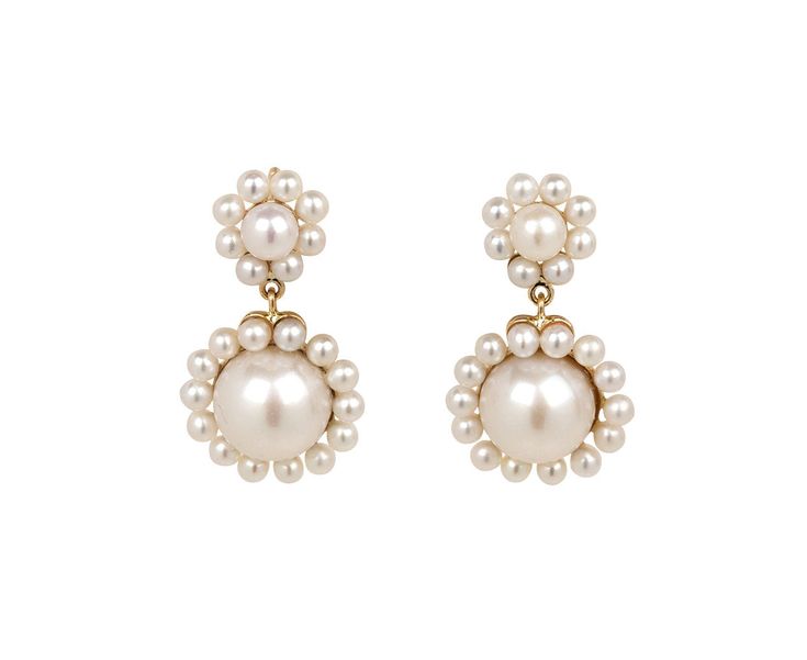 With their sweet design and classic materials, these Sophie Bille Brahe earrings are surprisingly easy-to-wear. Round, white freshwater pearls are clustered together to create two tiny flowers which are set on polished 14K yellow gold backings and connect to 14K yellow gold post backs. The perfect earring for everyday with just a hint of movement. total length : just under 7/8"width : 1/2"freshwater pearls : vary : 2mm diameter to 7mm diameter each14K yellow gold post backs Classic Yellow Gold Flower Earrings For Wedding, Classic White Flower Earrings For Formal Occasions, Formal Pearl White Flower Earrings, Formal White Cluster Earrings With Pearl Drop, Classic Drop Flower Earrings For Formal Occasions, Formal Pearl Drop Flower Earrings, Elegant Yellow Gold Flower Earrings With Pearl Drop, Elegant Yellow Gold Pearl Earrings With Charm, Formal Pearl Cluster Earrings