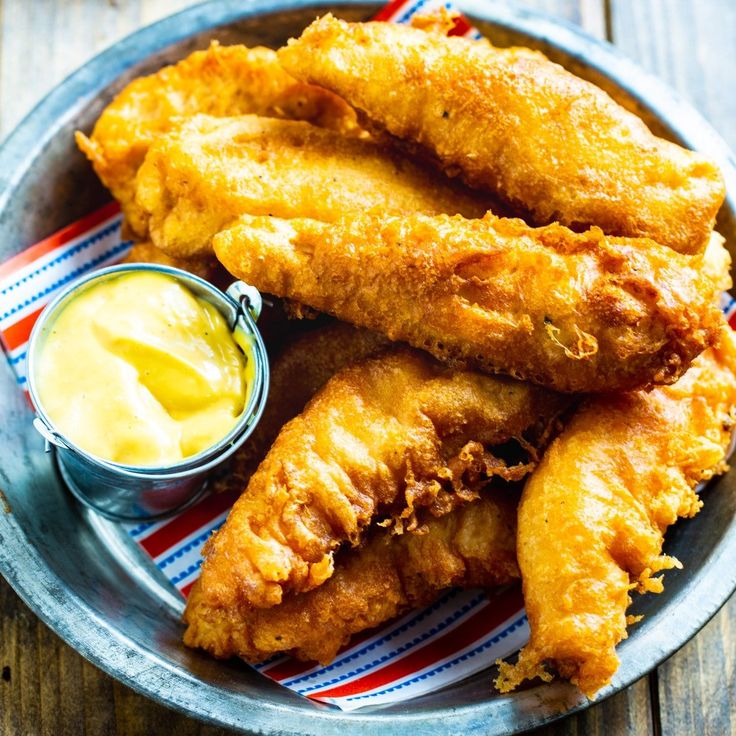 fried fish and dipping sauce on a plate