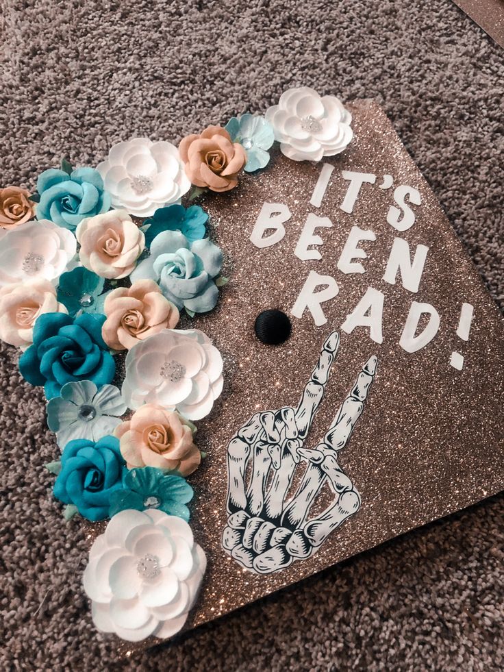 a graduation cap decorated with flowers and the words it's been rad on it