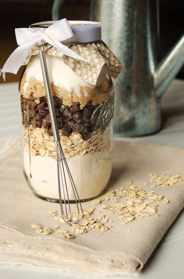 a mason jar filled with oatmeal and chocolate chips on top of a table