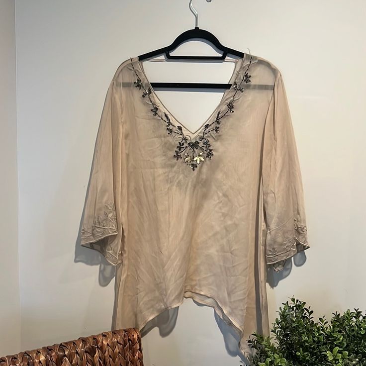 This Boho Shirt Is In Great Condition. The Beading Around The Neckline Is Perfectly Intact With No Snags. The Sheer Material Is A Cream/Taupe Color. The Fit Of This Shirt Is Effortlessly Flowly And Perfect For Layering Or To Stand In Its Own. Sleeves Are 3/4 Length And The Sides Of The Shirt Extend Down To Add To The Flow Of The Shirt. #Buckle #Gimmicks #Nwot #Nwt #Boho #Henley #Waffleknit #Knit #Longsleeve #Tee #Shirt #Top #Blouse Elegant Embroidered Beach Tops, Beaded Long Sleeve Summer Blouse, Elegant Beach Tops With 3/4 Sleeves, Elegant Embellished Tops For The Beach, Elegant Embellished Top For Beach, Bohemian Embellished V-neck Blouse, Embellished Summer Beach Blouse, Summer Beach Blouse Embellished, Summer Beach Embellished Blouse