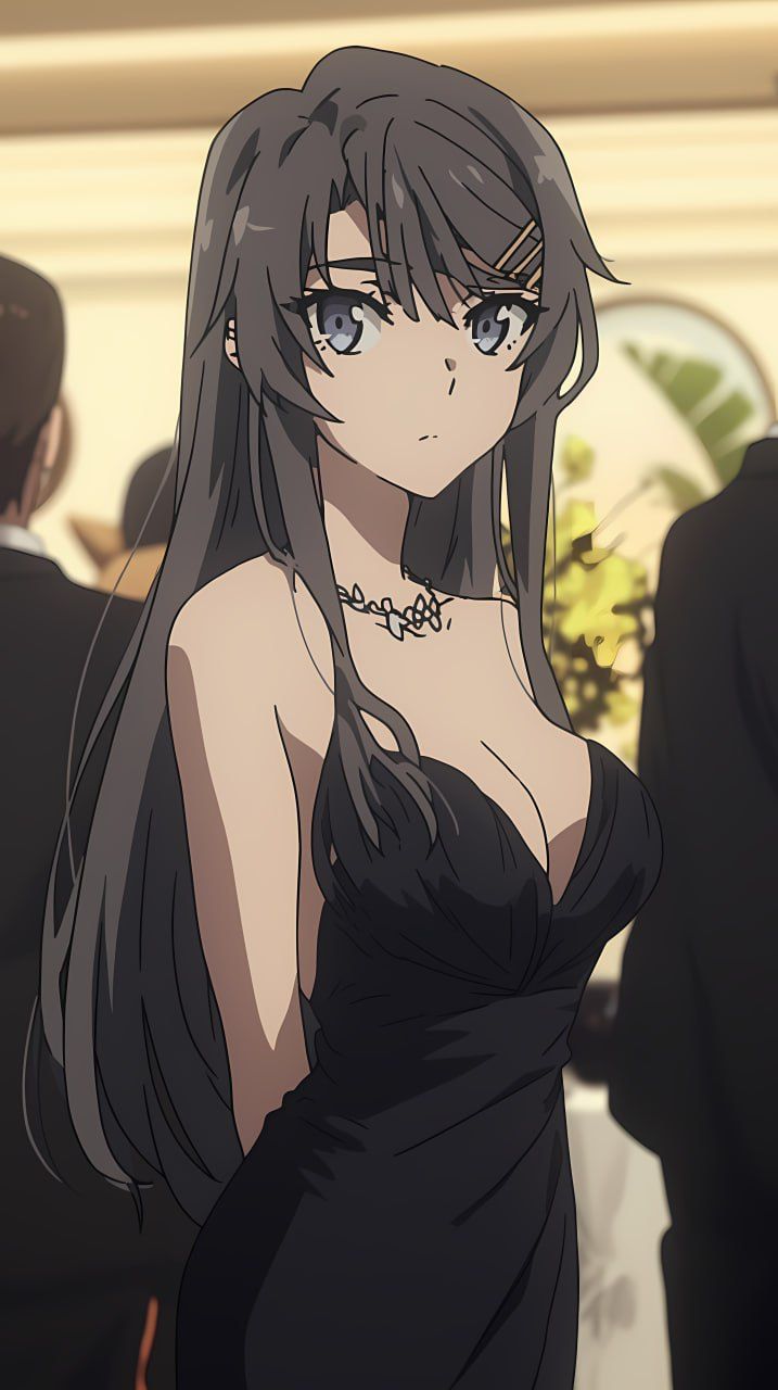 a woman in a black dress with long hair and blue eyes standing next to other people