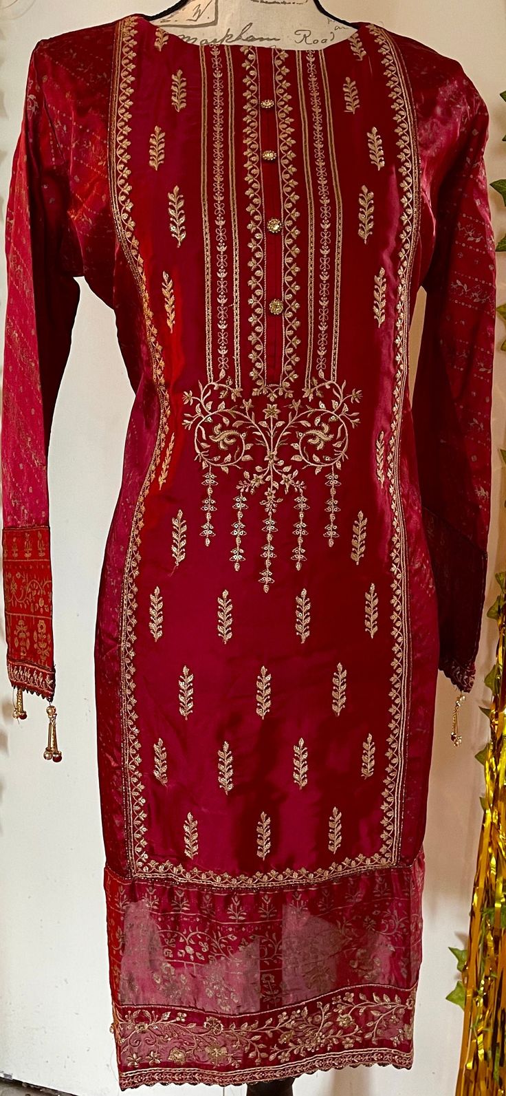 It is a beautiful ready to wear kurti for women. It is available in medium  size only. Chest 43 inches all around, waist 43, hips 46 and length 38 inches.  It is a beautiful embroided kurta with sequin work and block print on it. It is just a kurti no pants with this. It is bin Saeed branded kurti. Fabric silk. Color red. No return or exchange please. Red Cotton Silk Churidar With Straight Kurta, Navratri Silk Kurta For Designer Wear, Navratri Designer Silk Kurta, Silk Churidar For Navratri, Designer Red Straight Kurta, Red Straight Kurta For Designer Wear, Traditional Tunic With Traditional Drape For Festive Season, Anarkali Art Silk Salwar Kameez With Long Sleeves, Silk Tunic Sets For Wedding