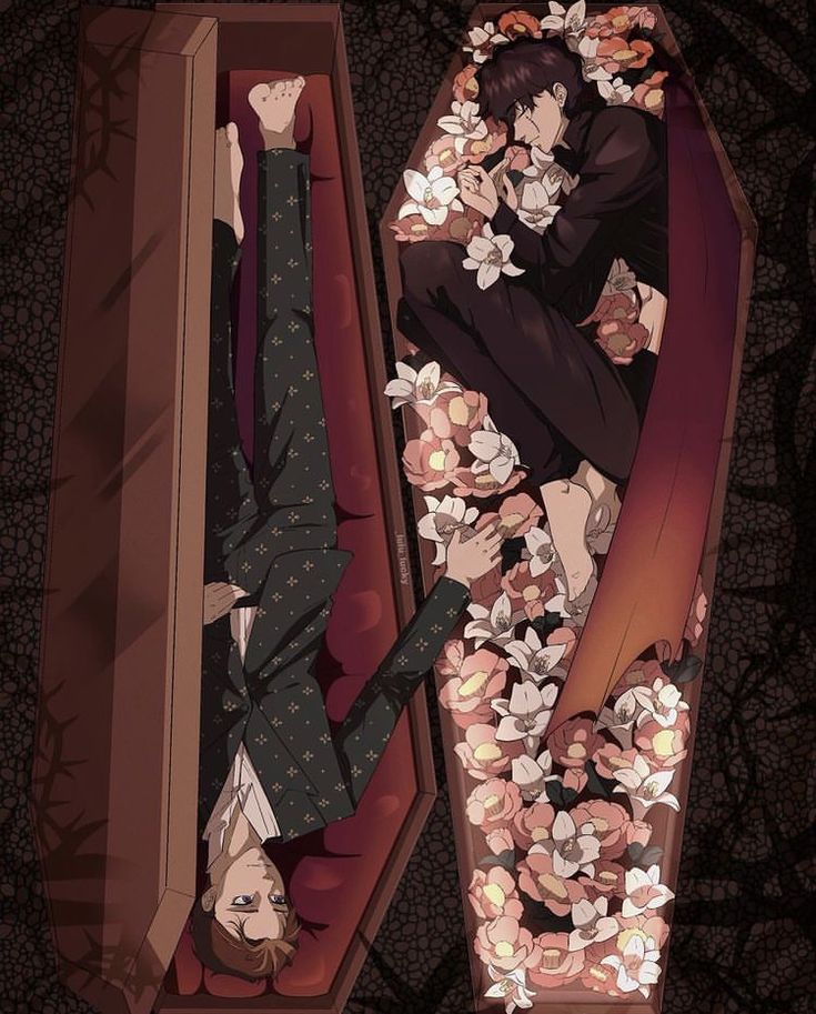 a man laying on top of a red couch covered in flowers next to a woman