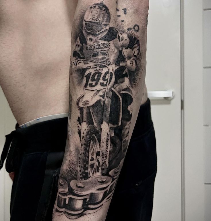 a man with a motorcycle tattoo on his arm