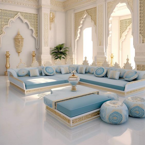 a living room filled with lots of blue and white furniture