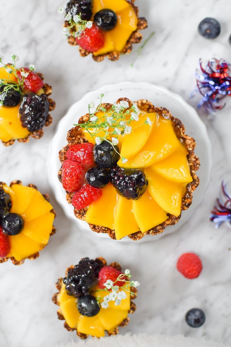 small desserts with fruit are arranged on a table