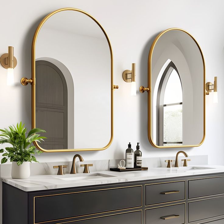 a bathroom with two sinks and mirrors on the wall next to a potted plant