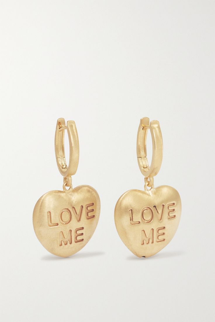 Lauren Rubinski's sweet pieces are handmade in Italy with love. Crafted from 14-karat gold, these earrings are strung with heart-shaped pendants and engraved with 'Love Me' in a script that's just big enough for any potential admirer to notice. Luxury Heart Charm Earrings For Valentine's Day, Valentine's Day Tarnish Resistant Brass Jewelry, Valentine's Day Yellow Gold-plated Earrings, Heart-shaped Gold-tone Earrings For Gift, 14k Yellow Gold Heart Pendant Earrings, Gold-tone Heart Shaped Earrings Gift, Yellow Gold Heart Pendant Earrings, Yellow Gold Heart Pendant Earrings In 14k, Valentine's Day Yellow Gold Huggie Jewelry