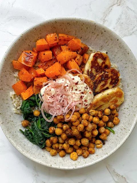 a white bowl filled with different types of food