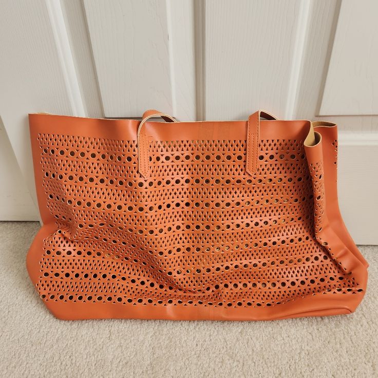 Saks Fifth Avenue Orange Leather Beach Bag. Brand New With Bag And Tag. Comes From A Smoke Free And Pet Free Closet. Color: Orange Size: 20 Inch Width At Widest, 12 Inch Length Leather Hobo Tote Bag For Vacation, Casual Leather Hobo Bag For Beach, Chic Beach Hobo Bag With Removable Pouch, Orange Beach Bag With Large Capacity For Shopping, Chic Hobo Bag With Removable Pouch For Beach, Chic Orange Bucket Bag For Travel, Leather Shoulder Bag With Removable Pouch For Vacation, Casual Orange Shoulder Bag For Shopping, Orange Tote Beach Bag For Shopping