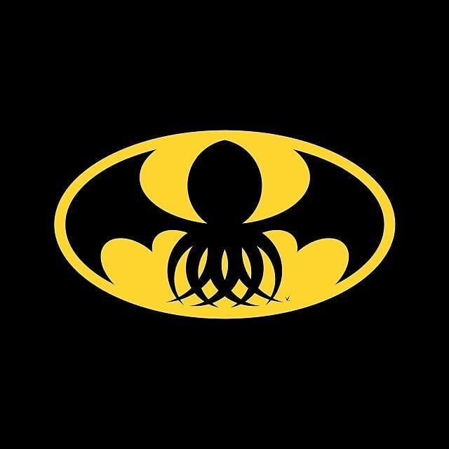 the batman symbol in black and yellow with an octopus on it's chest,