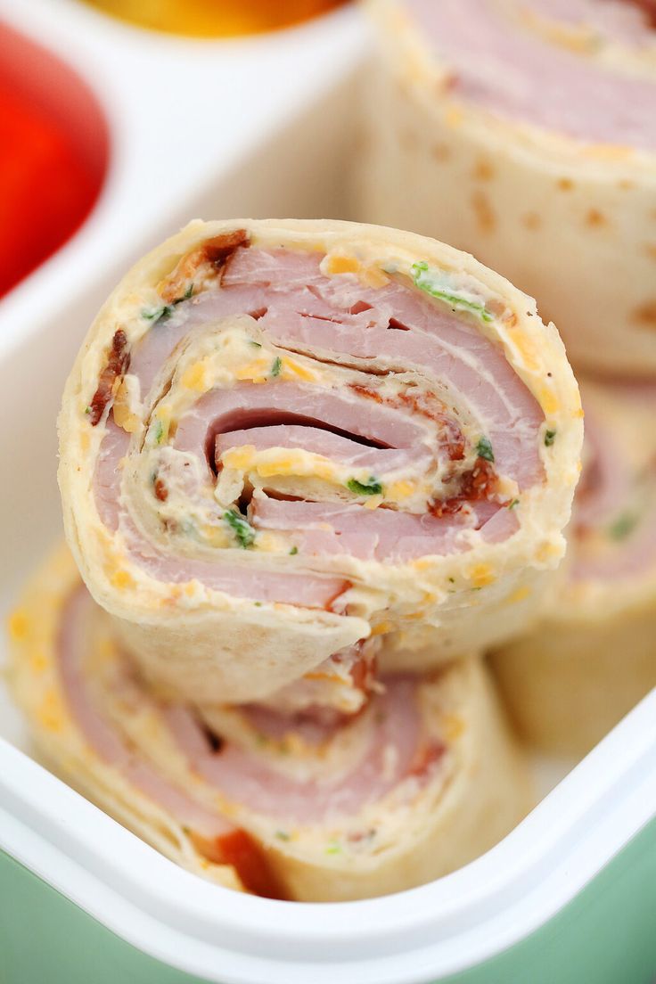 ham and cheese roll ups in a container