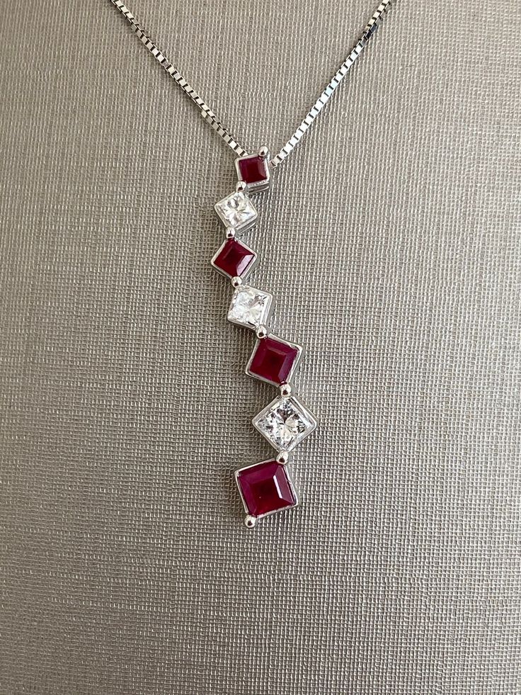 14 Karat White Gold Ruby and Diamond Square Shape Necklace Ladies Pendant For Her 18 inch chain length 3.1 grams Square Ruby Necklace, Ruby And Diamond Pendant, Elegant Square Pendant Necklace With Lobster Clasp, Anniversary Necklace With Square Pendant And Adjustable Chain, Formal Red Square Pendant Necklace, Costume Jewelry Anniversary Pendant Necklace, Anniversary Costume Jewelry Pendant Necklace, Costume Jewelry Pendant Necklace For Anniversary, Anniversary Necklace With Square Pendant And Box Chain