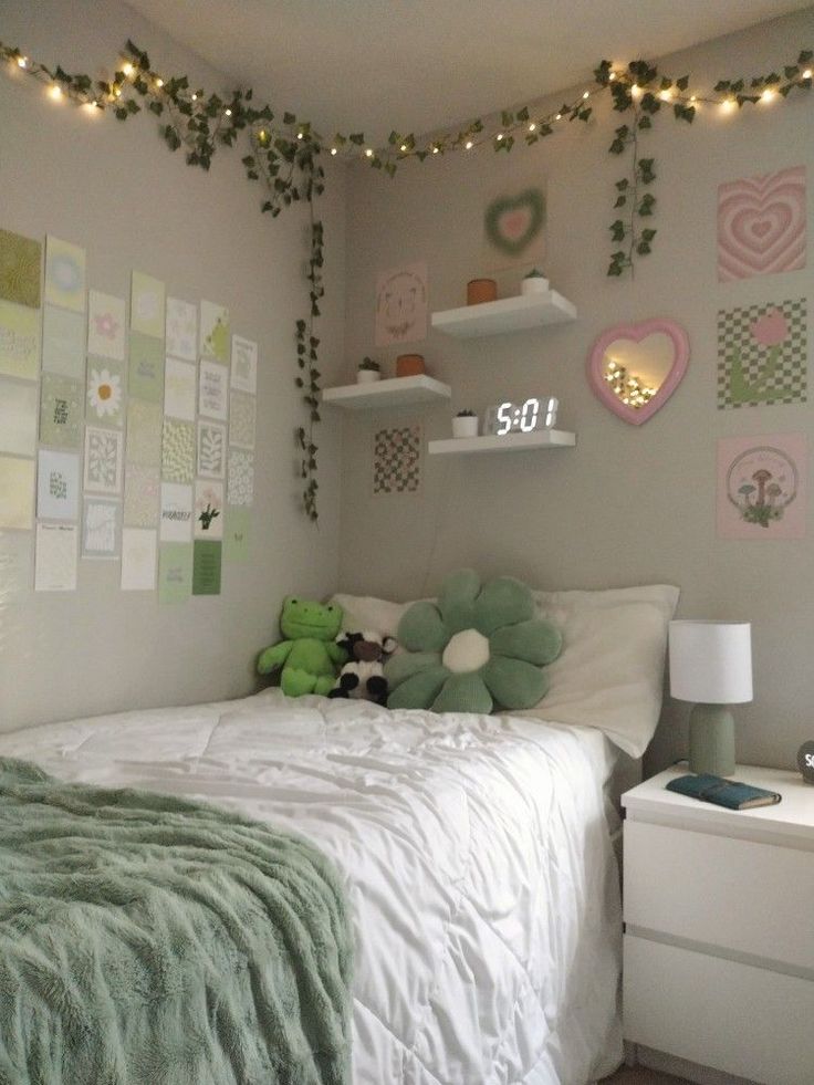 a bedroom decorated in pastel green and white with lots of decorations on the wall