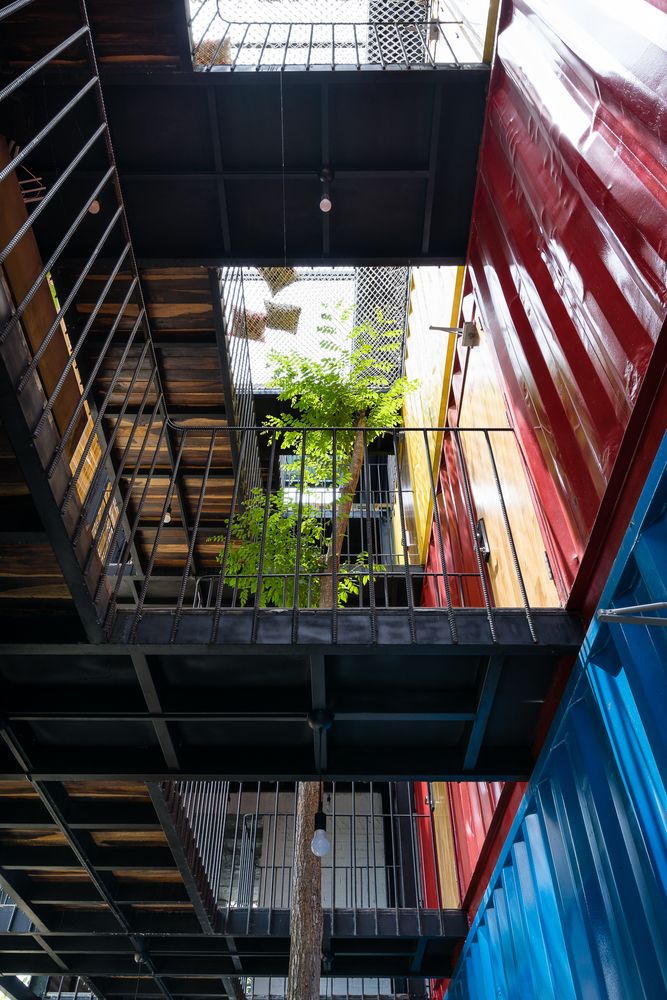 the inside of an apartment building with multiple floors and balconies on each floor