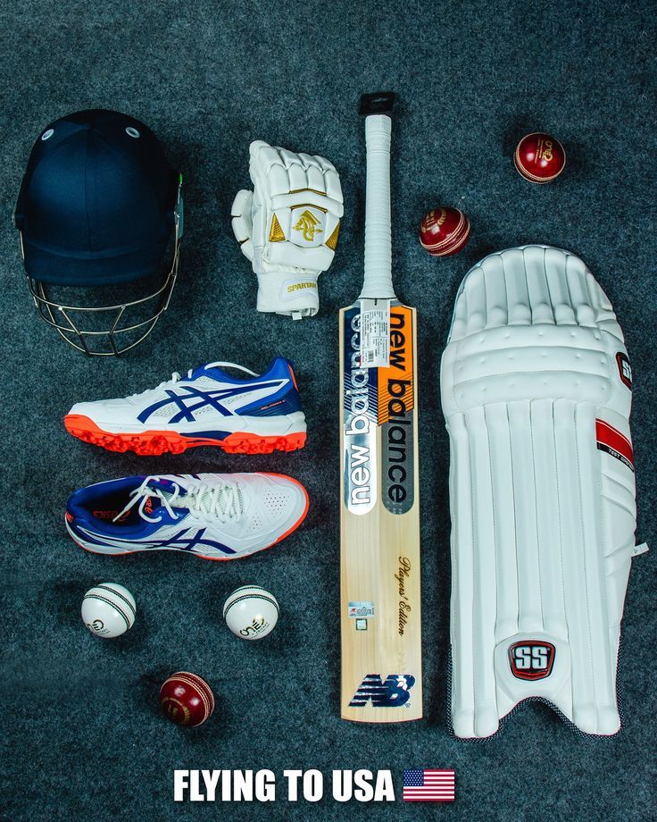 a baseball bat, glove and ball sitting on the ground with other sports equipment around it