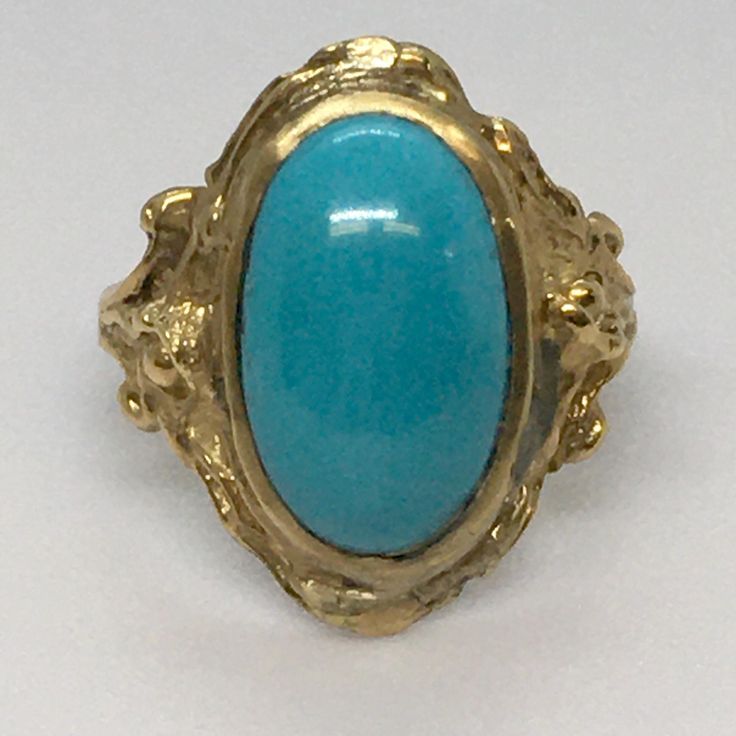 Vintage 14 Karat Gold Natural Persian Turquoise Lady's Ring  4.4 Gram  Size 5.25 14 mm by 9 mm Natural PersianTurquoise In good condition, no evidence of repair, wear and tear consistent with age, see pictures Add a touch of vintage elegance to your style with this stunning 14 karat gold cocktail ring. The oval-shaped natural persian turquoise gemstone is the star of the show, with its vibrant blue color and unique shape. The ring is handcrafted and features a yellow gold band, making it a perfect choice for a birthday or special occasion. This antique piece is a one-of-a-kind find, with no modifications and a Ring Size of 5.25. The turquoise gemstone is a secondary stone, with only one in the ring. The style is nature-inspired, with a cocktail design that will make you stand out in any ga Vintage 14k Gold Turquoise Ring, Collectible Vintage Turquoise Ring With Polished Finish, Vintage Turquoise Brass Jewelry, Vintage Cabochon Turquoise Ring, Persian Turquoise Ring, Cocktail Design, Retro Era, Persian Turquoise, Gold Cocktail Ring