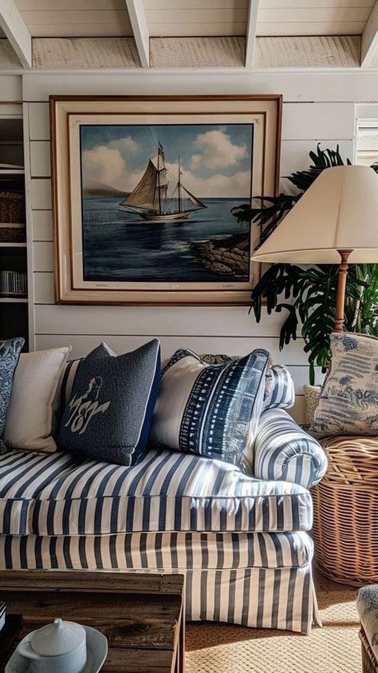 a living room filled with lots of furniture and pillows on top of it's couches