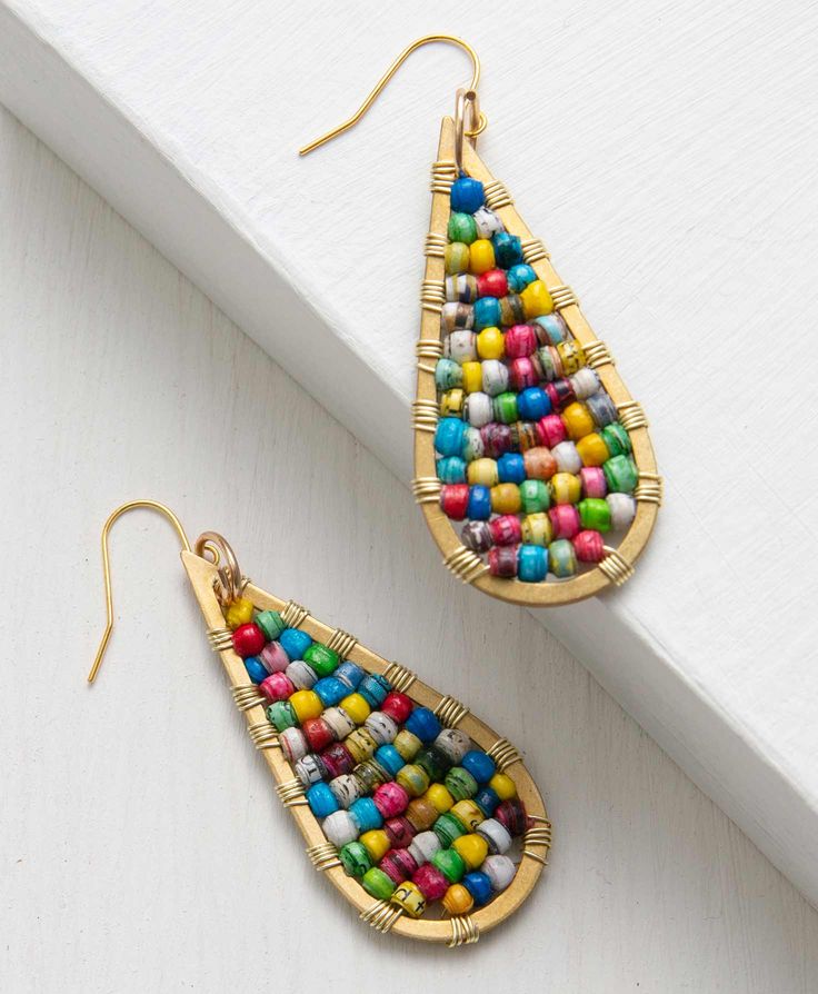 Fun, miniature handcrafted paper beads in a classic teardrop shape add a pop of color to any outfit. Handmade Teardrop Earrings For Festival, Artisan Colorful Beaded Teardrop Earrings, Artisan Teardrop Beaded Earrings With Dangling Beads, Multicolor Fair Trade Beaded Earrings, Gift Teardrop Earrings With Colorful Beads, Festival Teardrop Earrings With Ear Wire, Gold Teardrop Earrings With Colorful Beads, Bohemian Teardrop Earrings With Colorful Beads, Multicolor Beaded Teardrop Earrings For Gift