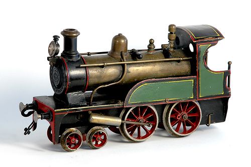 an old fashioned toy train is shown against a white background with no people around it