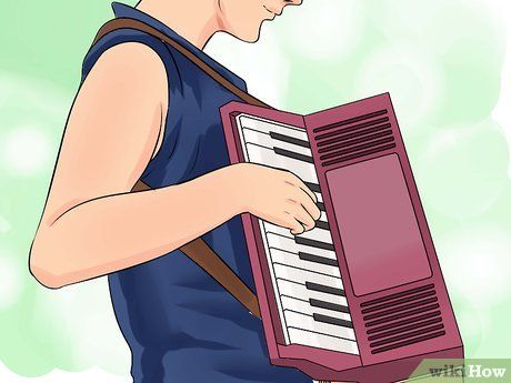 a man holding an accordion in his right hand and looking down at the keyboard on his left