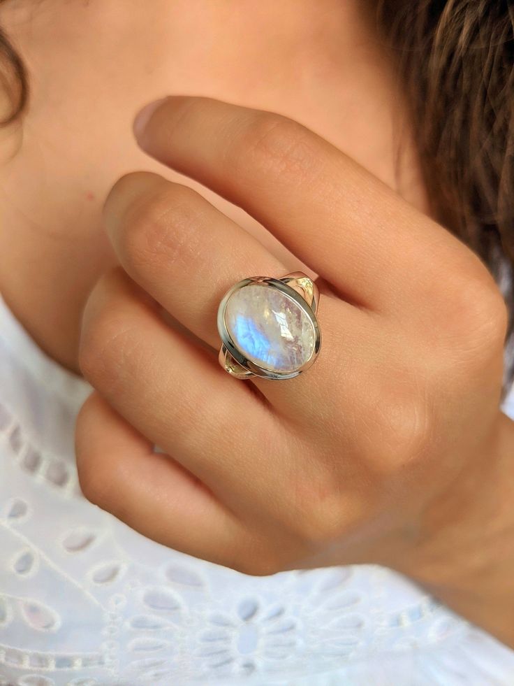 Introducing our Simple Chunky Sterling Silver Moonstone Ring, a timeless and versatile piece that effortlessly combines elegance and natural beauty. Crafted with meticulous attention to detail, this ring showcases a lustrous moonstone set in a chunky sterling silver band. The moonstone, known for its ethereal glow and captivating iridescence, is a stone of intuition, calmness, and feminine energy. Its mesmerizing play of light and colors adds a touch of enchantment to this ring, making it a trul Bohemian Moonstone Cabochon Jewelry, Bohemian Moon Charm Ring, Moon Shaped Moonstone Ring With Natural Stones, Bohemian Moonstone Jewelry With Large Stone, Bohemian Cabochon Moonstone Ring Gift, Bohemian Jewelry With Large Moonstone, Large Gemstone Rings, Bohemian Cabochon Moonstone Ring For Jewelry Making, Bohemian Oval Moonstone Jewelry