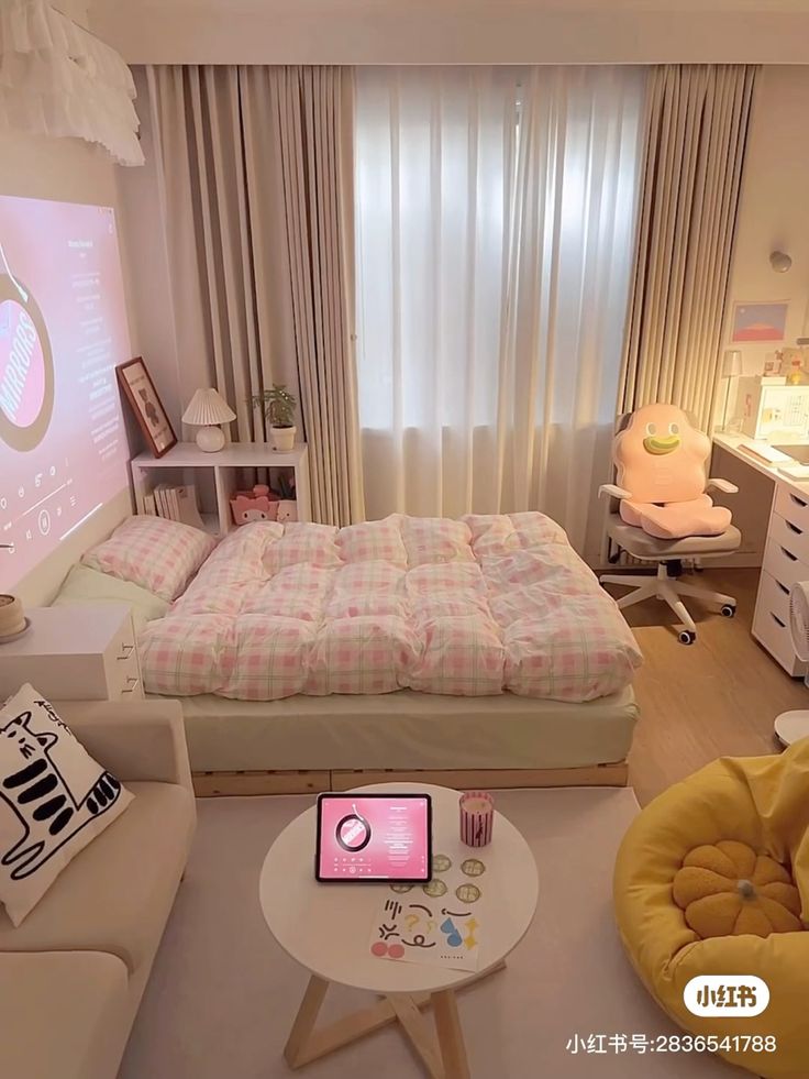 a bed room with a neatly made bed and a laptop on a table in front of it