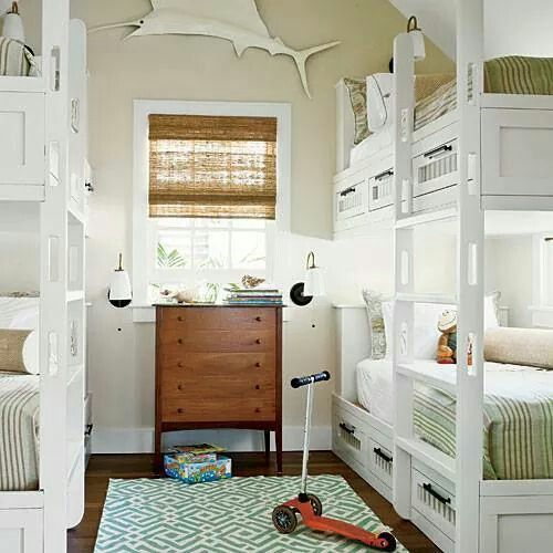 a room with bunk beds and toys on the floor