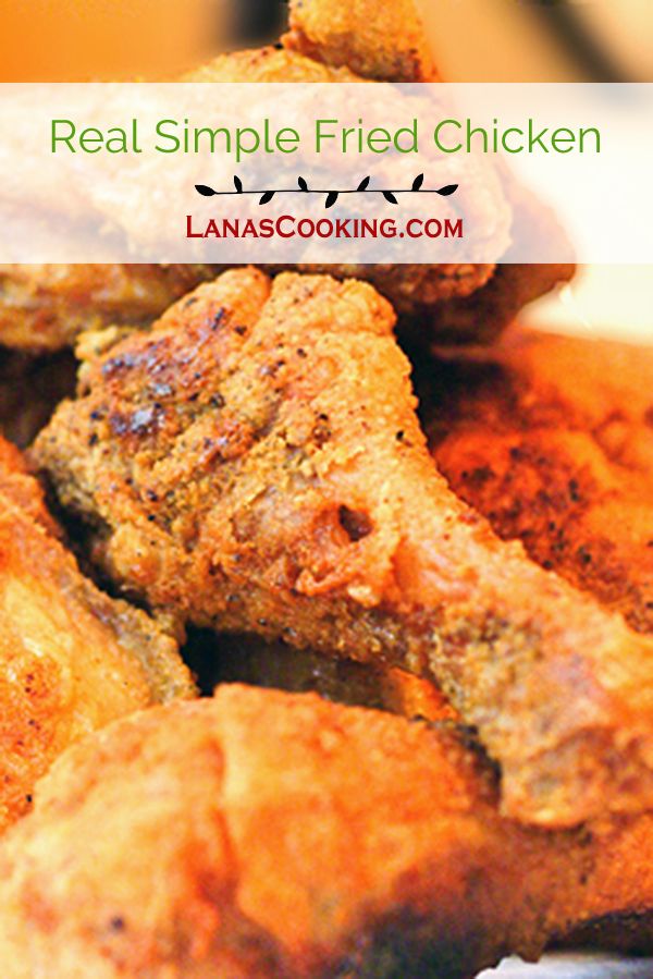 some fried chicken sitting on top of a plate with the words real simple fried chicken