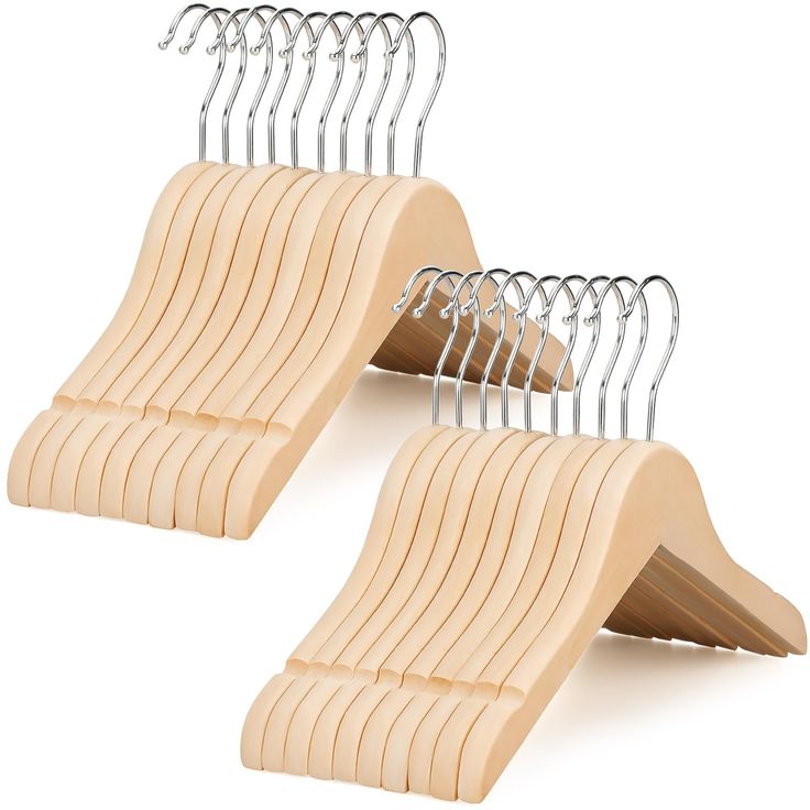 two wooden hangers with clips attached to them