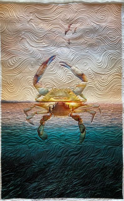 a crab in the ocean with two birds flying over it