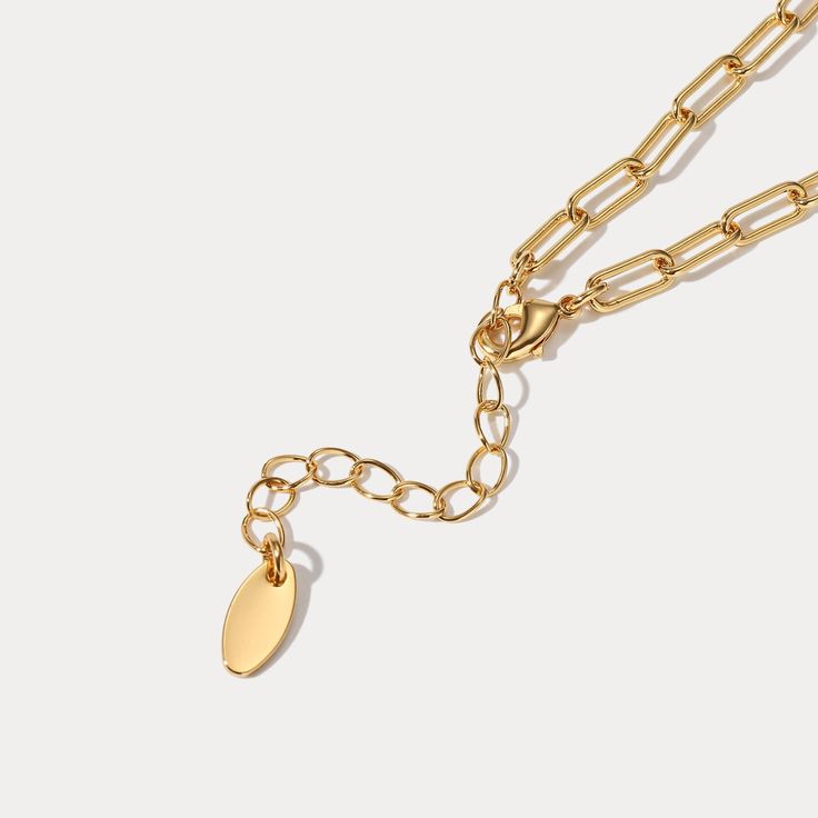 This exquisite 18K gold on brass Heart Lock and Key Necklace is designed to evoke the romantic mystery of a classic fairytale. Crafted with careful attention to detail, it will become a timeless addition to your jewelry collection. An effortless accessory with which to enchant, this luxurious necklace will be your go-to for timeless elegance. DETAILS Plating: 18K Gold Materials: 18K Gold on Brass, Cubic Zirconia Measurements: Length: 17.83"(45.3cm) + Extender: 1.97"(5.0cm) Weight: 13.55g Gold Heart Pendant Locket Necklace Dainty Style, Elegant Heart Pendant Chain Necklace With Lobster Clasp, Gold Dainty Heart Pendant Locket Necklace, Elegant Chain Necklace With Heart Pendant And Lobster Clasp, Gold-tone Heart Pendant Chain Necklace Tarnish Resistant, Gold-tone Heart Pendant Chain Necklace, Dainty Gold Heart Pendant Locket Necklace, Elegant Heart Pendant Charm Necklace On Gold Chain, Elegant Heart Pendant Charm Necklace With Gold Chain