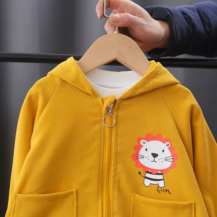 This Lion Cartoon Graphic Print Hooded Jacket is a must-have for the autumn season. It has a zipper lock-up style and is made of cotton materials. Its hooded design makes it even more suitable for keeping your kids warm and comfortable on cold days. Plus, the lion design makes it fashionable and trendy. Features: Perfect for autumn, or any day. Zipper lock-up style. With hood and side pockets. Comfortable to wear. Fabric & Care: Made of high-quality cotton materials. Hand-washed preferred. Do no School Cotton Long Sleeve Hoodie, Cotton Long Sleeve Hoodie For School, Cotton Long Sleeve School Hoodie, Winter Cotton Hooded Jacket With Zipper Closure, Outdoor Cotton Hoodie With Detachable Hood, Yellow Cotton Hoodie With Pockets, Cotton Hooded Jacket With Zipper For Fall, Cotton Hoodie For School, Cotton Hooded Jacket With Kangaroo Pocket