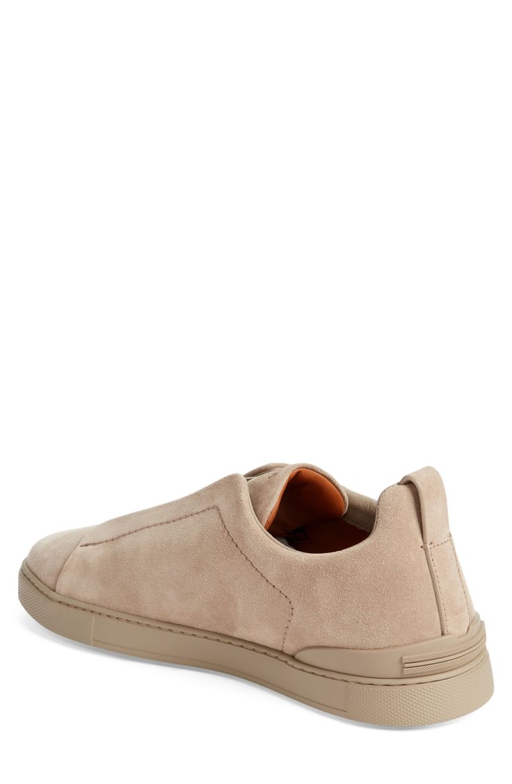 This soft and supple suede sneaker slips on easily with crisscrossed elastic at the vamp and is set on a tonal rubber cupsole for a casual aesthetic. Pull-on style Leather upper and lining/synthetic sole Made in Italy Designer Shoes Modern Suede Slip-on Sneakers, Suede Slip-on Sneakers With Leather Sole, Slip-on Suede Sneakers With Leather Sole, Slip-on Sneakers With Suede Lining And Round Toe, Leather Low-top Slip-ons With Suede Lining, Modern Suede Slip-on Sneakers With Leather Sole, Modern Slip-on Suede Sneakers With Leather Sole, Sporty Suede Slip-on Sneakers With Rubber Sole, Slip-on Sneakers With Suede Lining