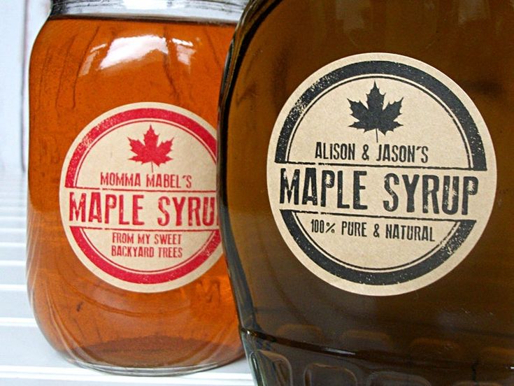 two maple syrups are sitting next to each other